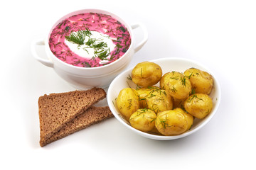 Beetroot soup with sour cream and fried potatoes, isolated on white background.