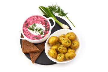 Beetroot soup with sour cream and fried potatoes, isolated on white background.