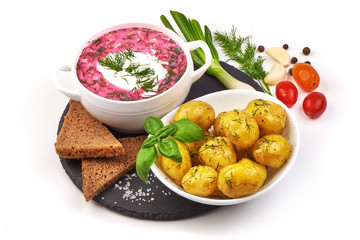 Beetroot soup with sour cream and fried potatoes, isolated on white background.