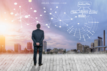 Obraz premium Businessman looking at business concept against cityscape