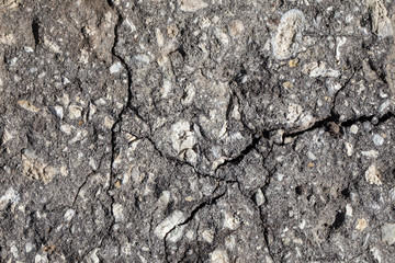 Close-up texture of cracked stone wall