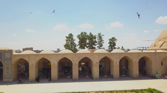 Aerial panoramic drone view of traditional houses, roofs, mosque and area. Iran, Kerman may 2018