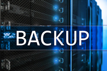 Backup button on modern server room background. Data loss prevention. System recovery.