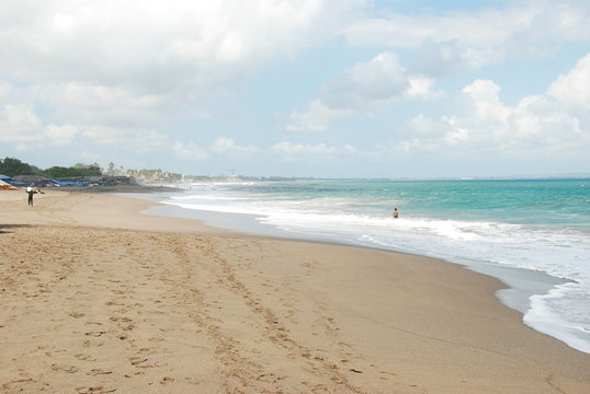 The coast of Pantai Batu Bolong Beach and sea with huge waves, south Bali, Indonesia 