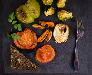 Grilled vegetables on a dark background.