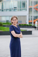 Young confident businesswoman at the office, smiling