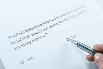 Should businesses be required to provide paid leave for full-time employees during the birth of a child or sick family member? No