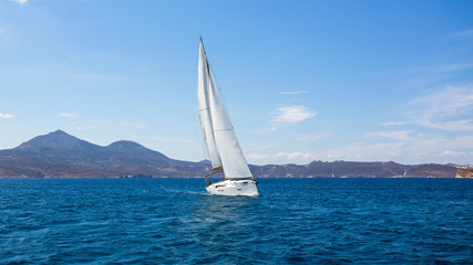 Sailing ship luxury yacht with white sails in the Sea.