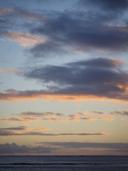 Naklejka na ściany i meble clouds above the horizon during sunset