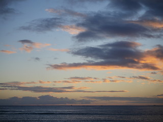 clouds above the horizon during sunset