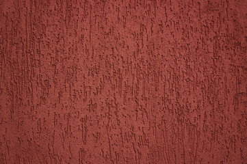 Brick red plaster textured wall. Textured background, good as wallpapers.