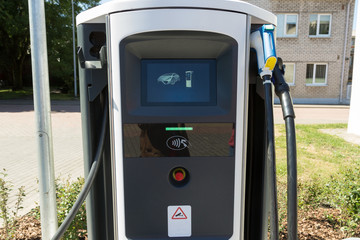 Charging station for electric vehicles, electro car charging station on gas station.