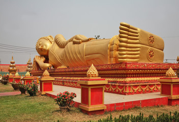 Fototapeta na wymiar Reclining Buddha at Wat That Luang Tai temple in Vientiane. Laos