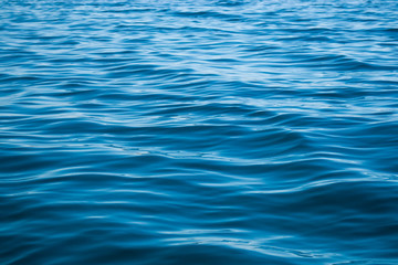 Deep blue water texture with some big and small waves