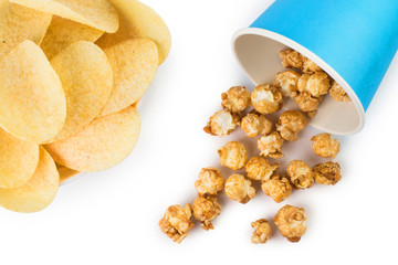 Potato chips and caramel popcorn, isolated on white background