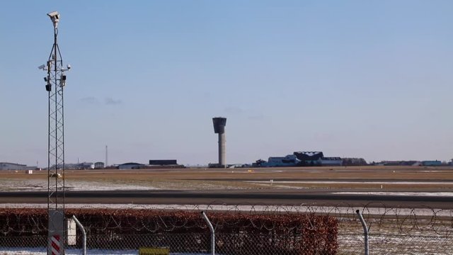 Airport airside with safety car racing over
