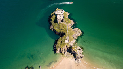 Aerial drone view of an old, historic fort on a small island off a picturesque, colorful coastal...