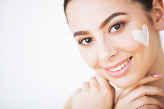Skincare. Woman With Healthy Face Applying Cosmetic Cream Under The Eyes