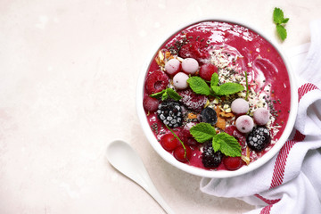 Summer berry smoothie bowl.Top view with copy space.