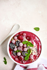 Summer berry smoothie bowl.Top view with copy space.