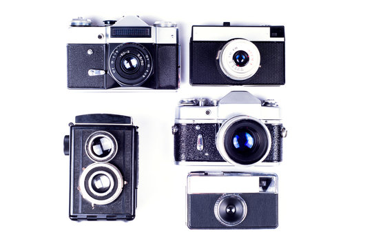 Old cameras on a white background