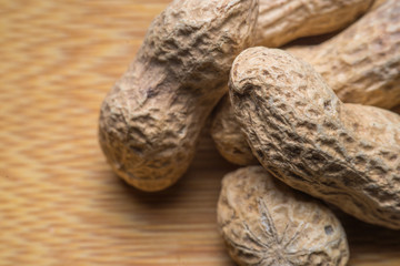 background of the peanuts with the shell not peeled - top view