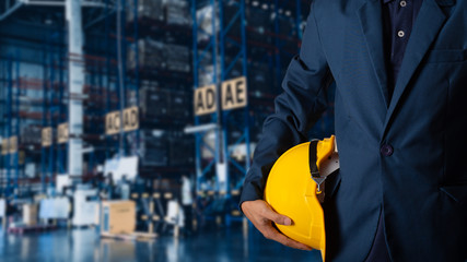 Business Logistics concept, Double exposure of engineer or worker hold yellow helmet for workers security with Modern Trade warehouse logistics