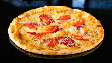 Tasty Italian pizza on a dark