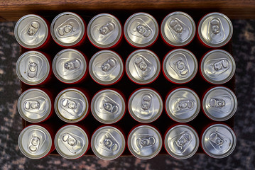 Top view aluminium cans. Beer cans on dark background