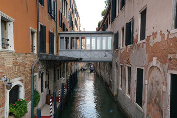 Fototapeta na wymiar Venice,Italy-July 25, 2018 : View of canal Rio del Vin from bridge Ponte del Vin at Venice's waterfront promenade Riva degli Schiavoni.