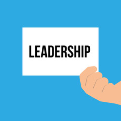 Man showing paper LEADERSHIP text
