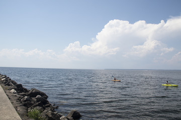 people in canoe on lake in the midwest on a beautiful summer day