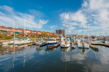 Fototapeta na wymiar Boats in a marina on the waterfront in Canton, Baltimore, Maryland