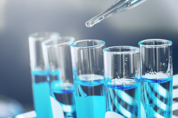 Glass laboratory chemical test in lap room. Science concept