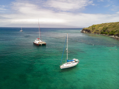 Snorkeling And Sailboats In Honolua Bay On Maui, Hawaii