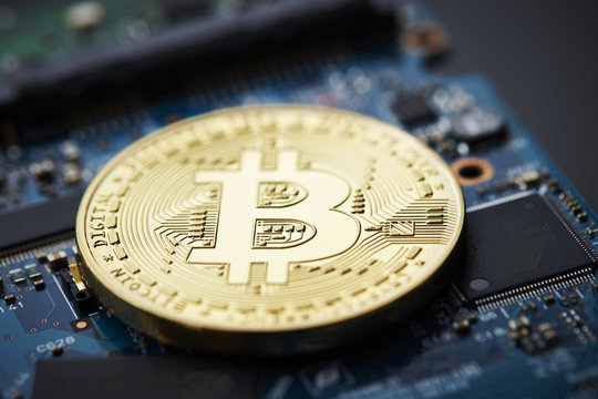 Cryptocurrency coin on circuit board 
