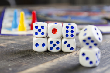 board game with white cubes on a wooden table