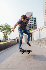 Skateboarder doing a skateboard trick ollie