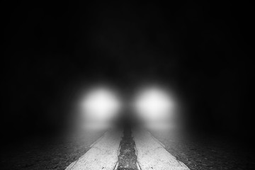 The lonely street  at night with the car running.