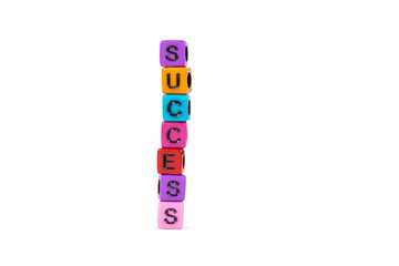 SUCCESS text made from colorful beads or letter bead on white background, finance and business concept.