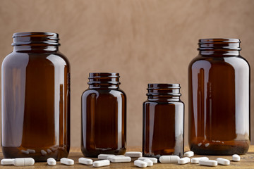 Four pharmaceutical bottles with different pills