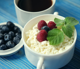 Russian cottage cheese with berry and mint, blueberries and coffee.