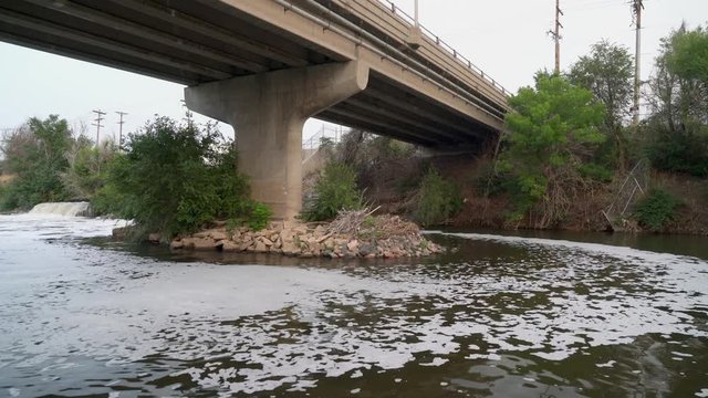 sewage effluent from Denver metro wastewater treatment facility is creating a foam vortex upstrem the South Platte River in Colorado