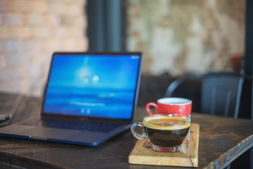Coffee on wood table in coffee shop