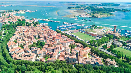 Aerial view of Venetian lagoon and cityscape of Venice island in sea from above, Italy
