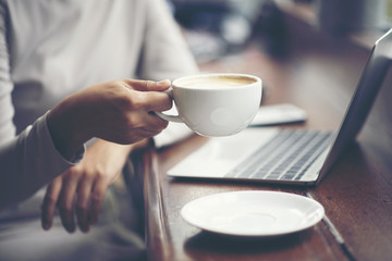 Morning coffee. Woman holds a coffee cup, business concept