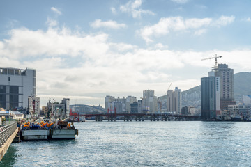 Fototapeta premium Amazing view of Busan in South Korea. Parked fishing vessels