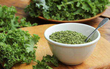 Chopped dry kale leaves on rustic background