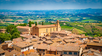 Fototapeta na wymiar Aerial view of medieval tuscan town with church, San Gimignano, Tuscany, Italy.