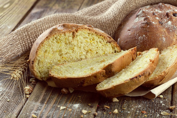 baked bread on wooden table background